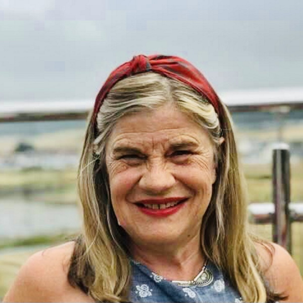 image of author Carole Hamilton wearing a red headband